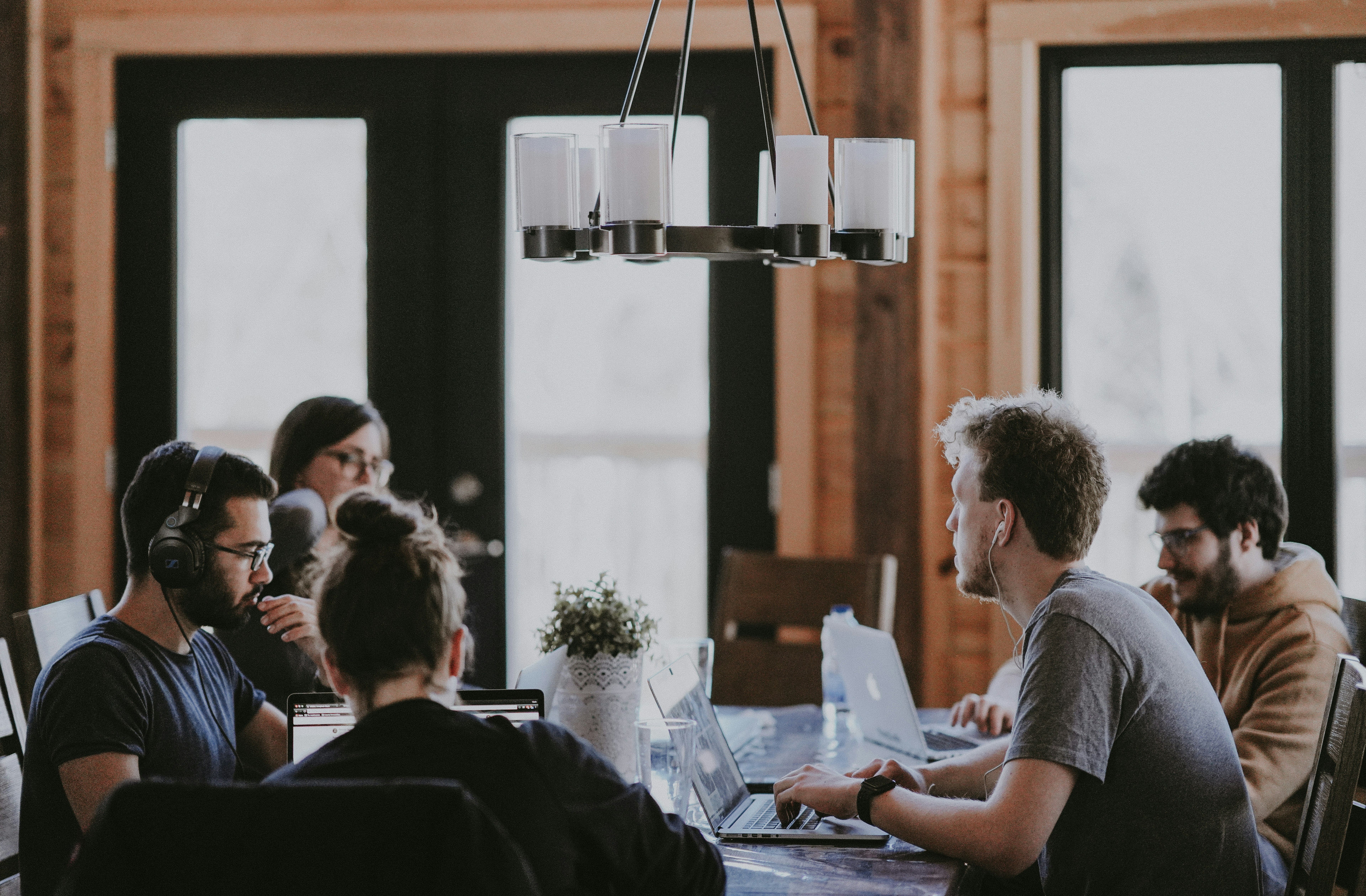 Person drinking coffee in coworking environment